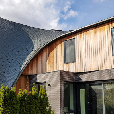 A zinc-shingled curved roof in North York, by Alrpo Metal Roofing.