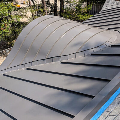 24 Guage 1.5" Standing Seam Metal Roof on a Barrel Dormer in Charcoal.