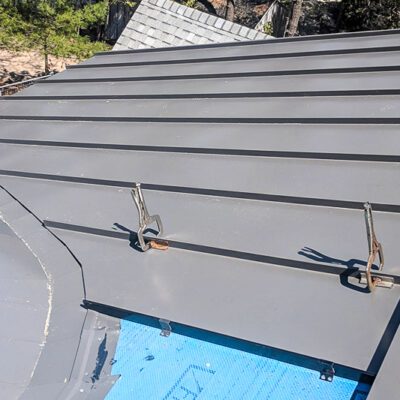 24 Guage 1.5" Standing Seam Metal Roof on a Barrel Dormer in Charcoal.