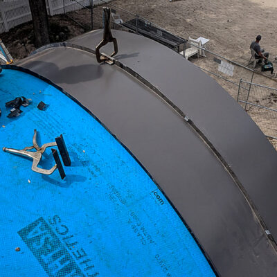 24 Guage 1.5" Standing Seam Metal Roof on a Barrel Dormer in Charcoal.