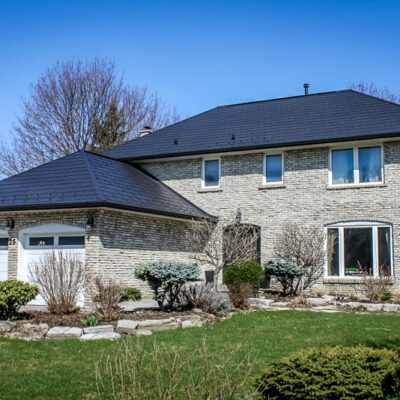 Black metal shingles on a residence, one of Alpro Metal Roofing projects.