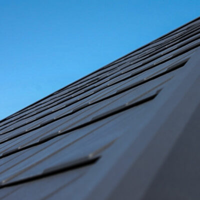 Close up of black metal shingles.