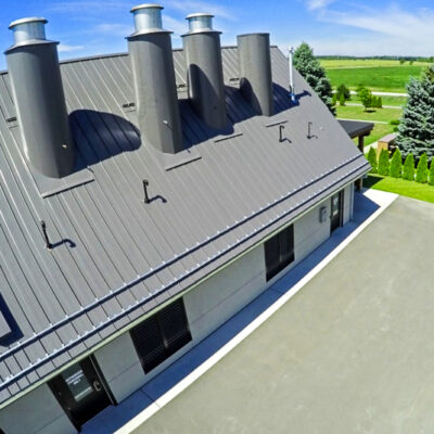 Standing seam metal roof with custom metal chimney's for a crematorium.