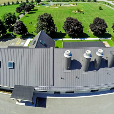 Standing seam metal roof with custom metal chimney's for a crematorium.