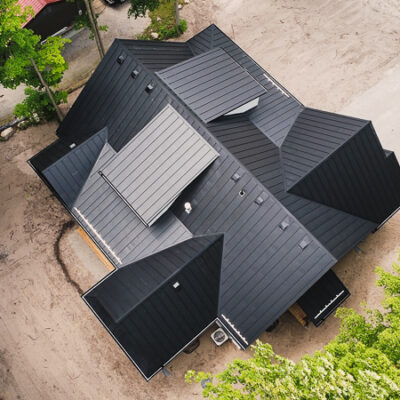 24g textured black standing seam on a home.