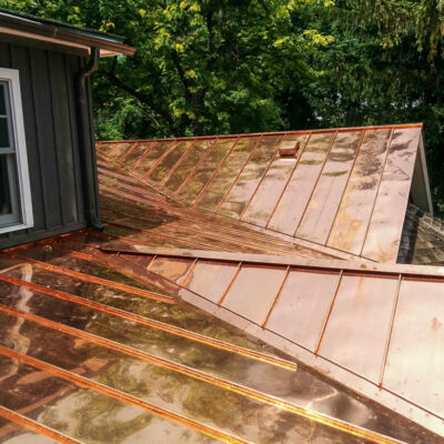 Standing seaming copper roof by Alpro Metal Roofing.